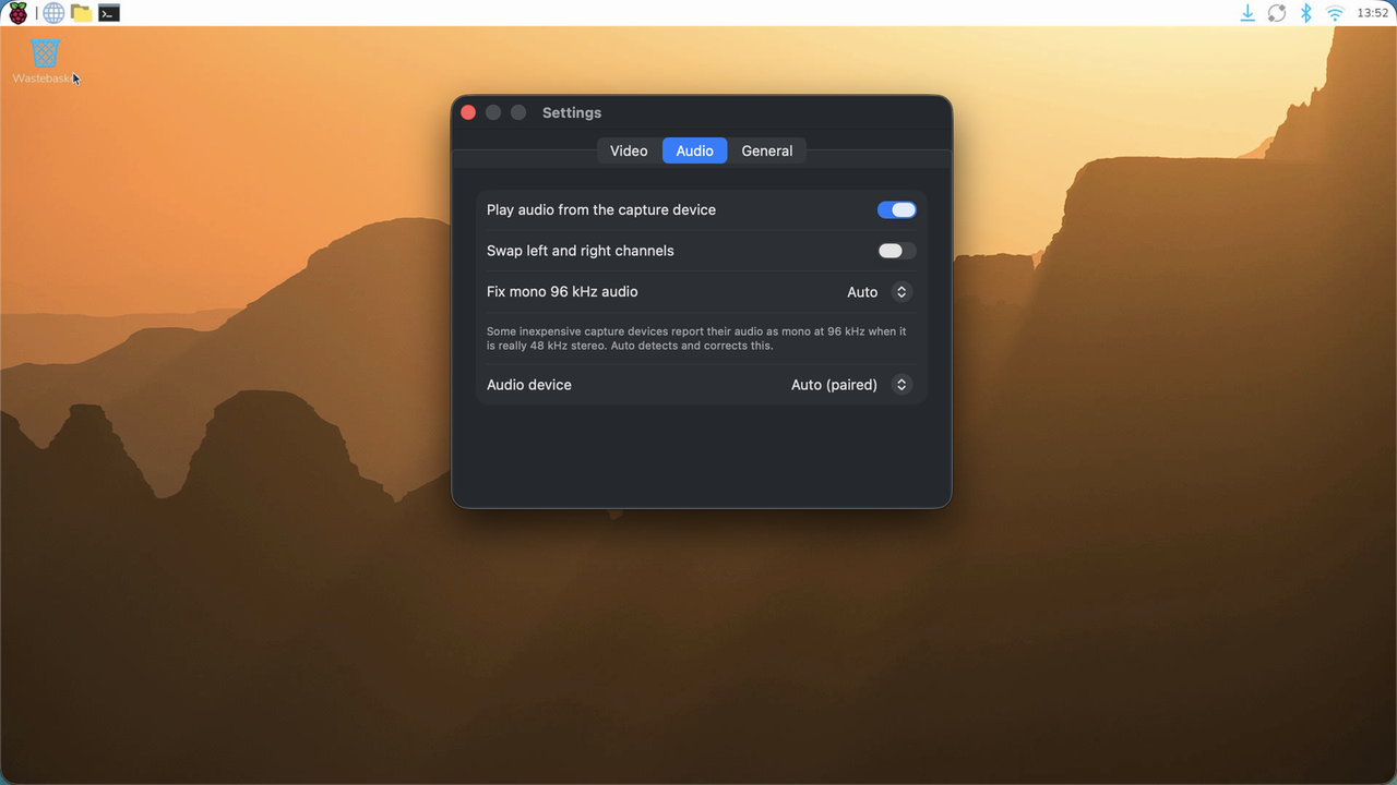 Screenjack's Settings window on the Audio tab: Play audio from the capture device, Swap left and right channels, Fix mono 96 kHz audio set to Auto, and Audio device set to Auto (paired).